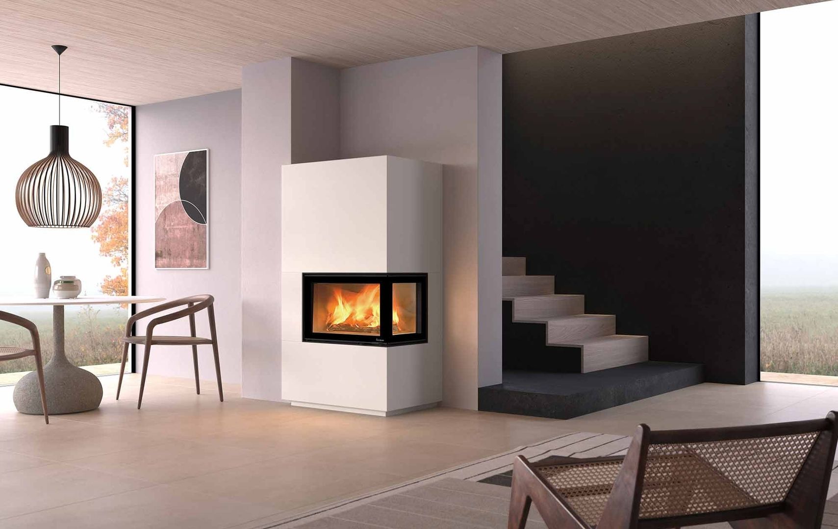 Modernes Wohnzimmer mit schlichtem weißem Kamin, Holztreppe und rundem Tisch mit Pendelleuchte inmitten einer ruhigen Landschaft.